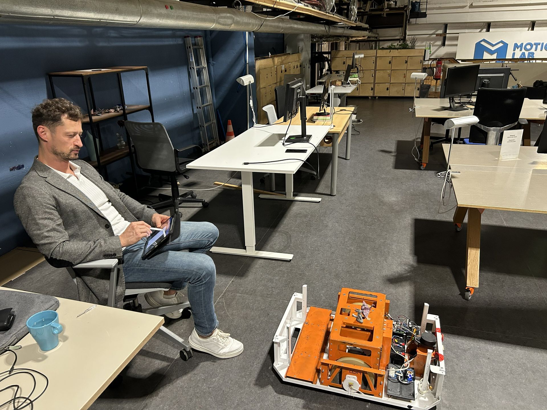 Alex working with OpenAMRobot at MotionLab Berlin